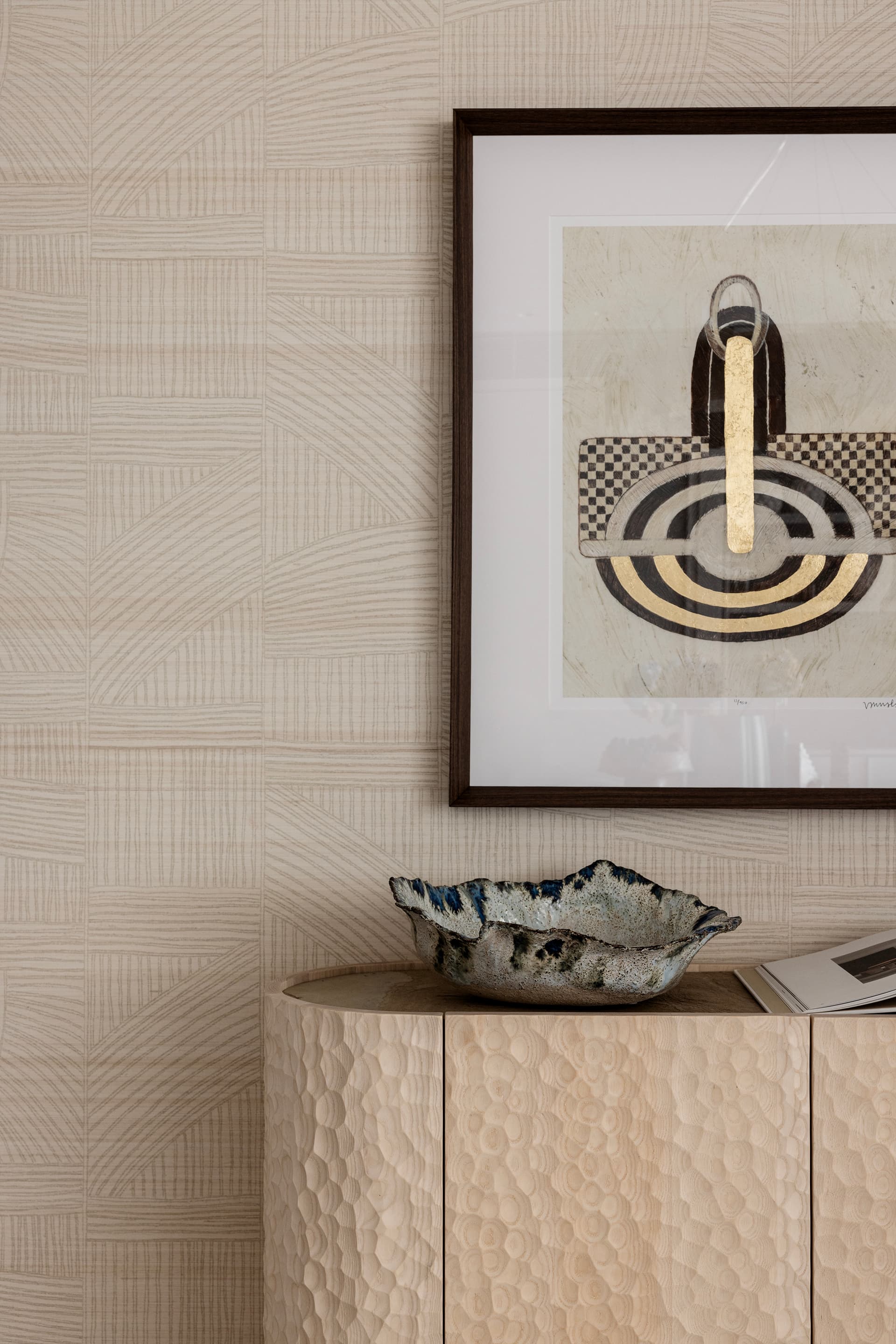 Artwork and carved credenza detail