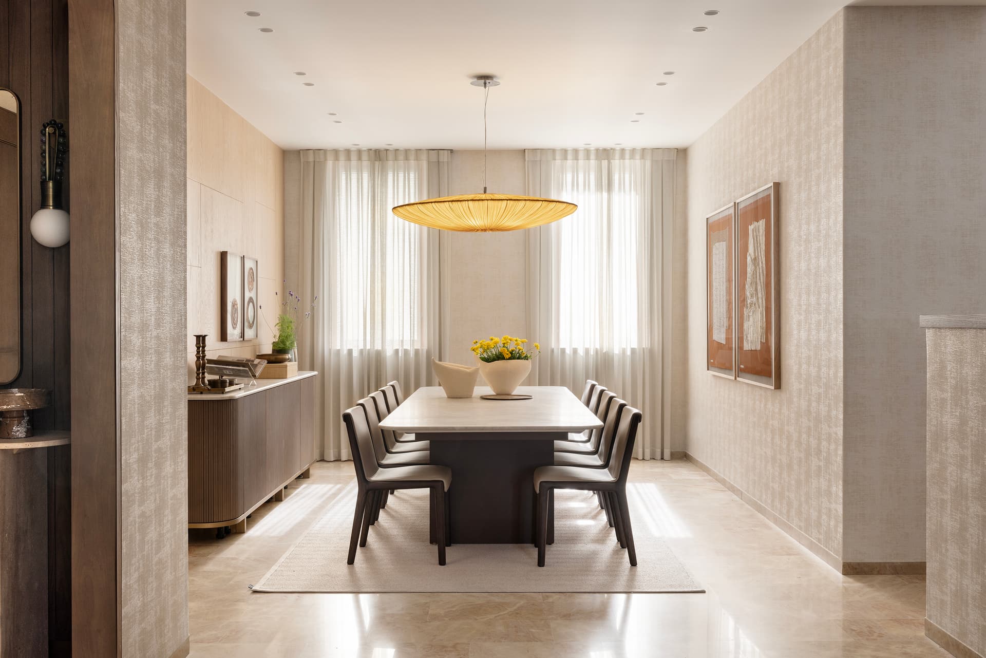 Formal dining room with woven pendant and sheer curtains